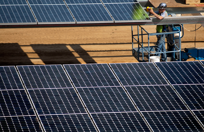 Solar panels installed over parking lot