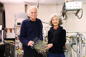 Walter de Heer and Claire Berger holding an atomic model of graphene on crystalline silicon carbide