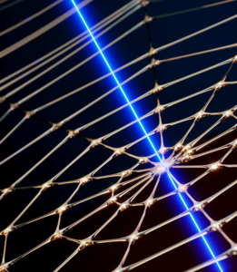 Artist impression of an artificial spider web probed with laser light