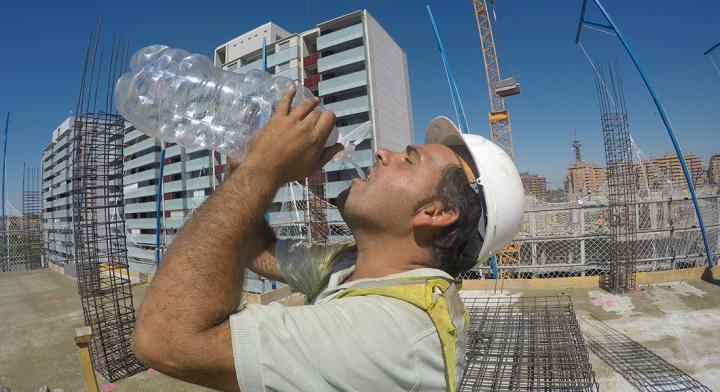 Spanish Construction Worker during Water Break