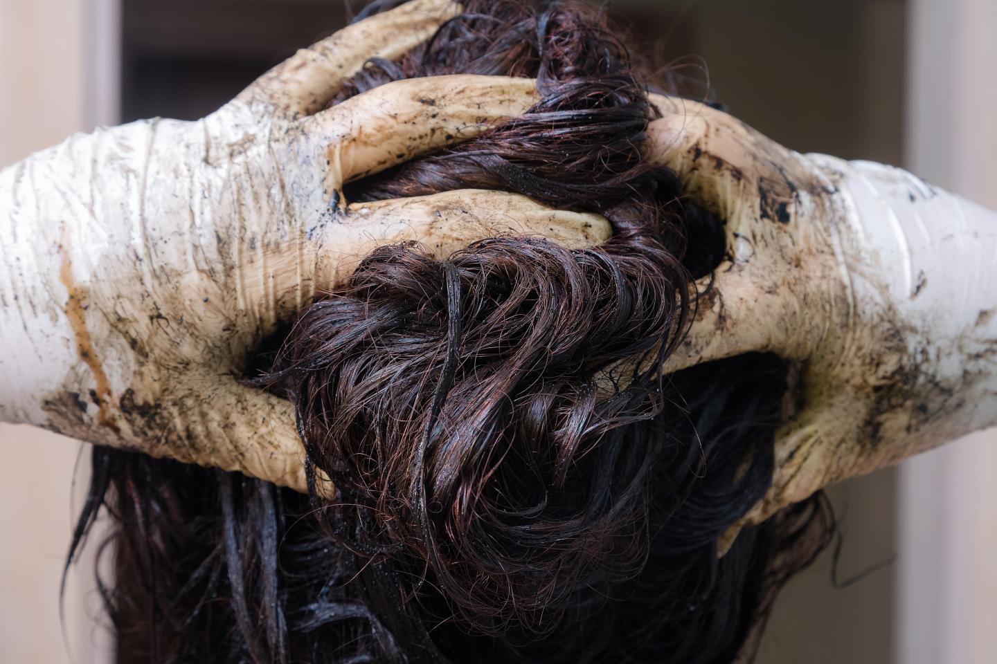 Woman Using Permanent Hair Dye