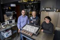 Metamaterial Researchers Pose with their Device