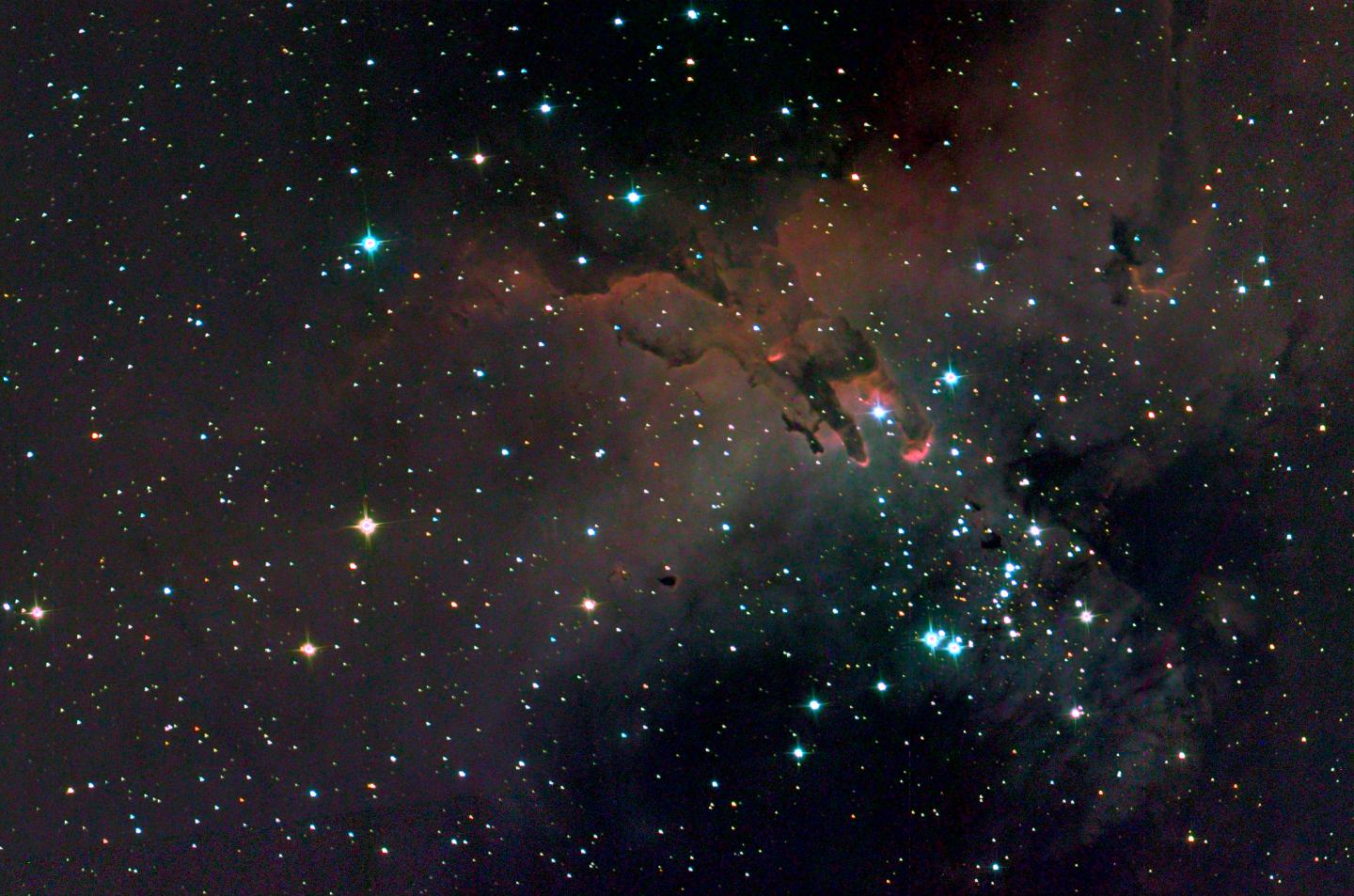 A SuperBIT optical and ultraviolet composite image of the 'Pillars of Creation'