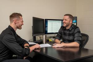 Hunter Ball (right), associate professor of psychology at UTA