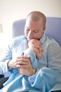 Father Holds Premature Baby
