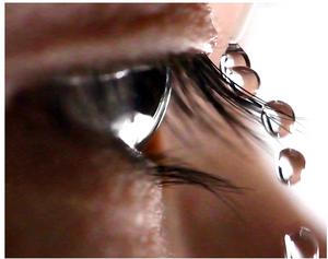 Water droplet slides off eyelash