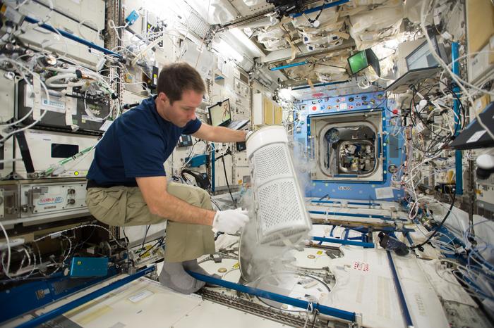 Astronaut Thomas Pesquet inserts blood samples for MARROW into the Minus Eighty-Degree Laboratory Freezer aboard the ISS.