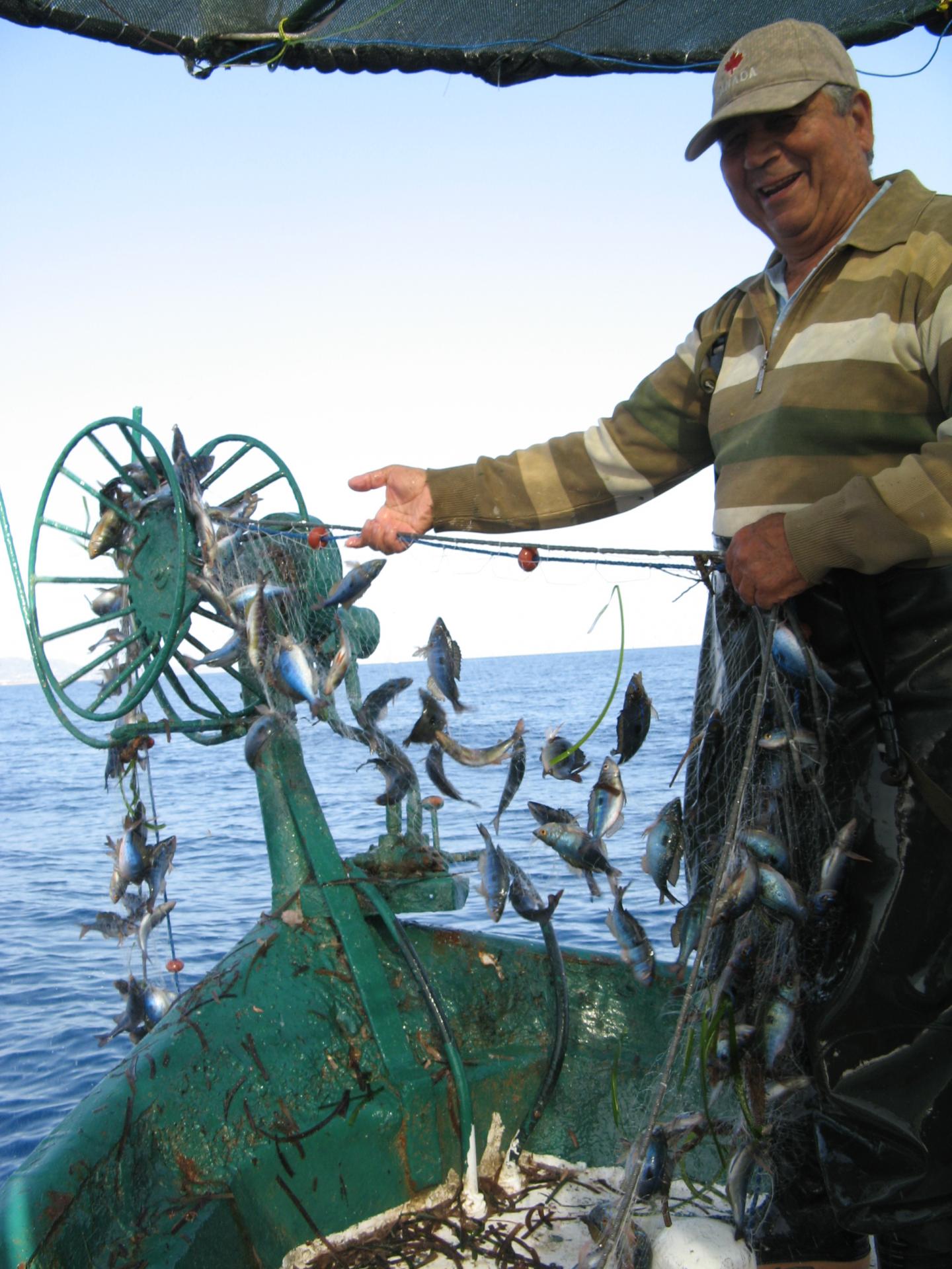 Fisherman and Fish [IMAGE] EurekAlert! Science News Releases