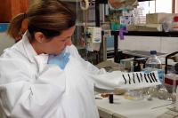 Researcher Susana Guzmán with the E-Textile Prototype, in a Laboratory of the Faculty of Science