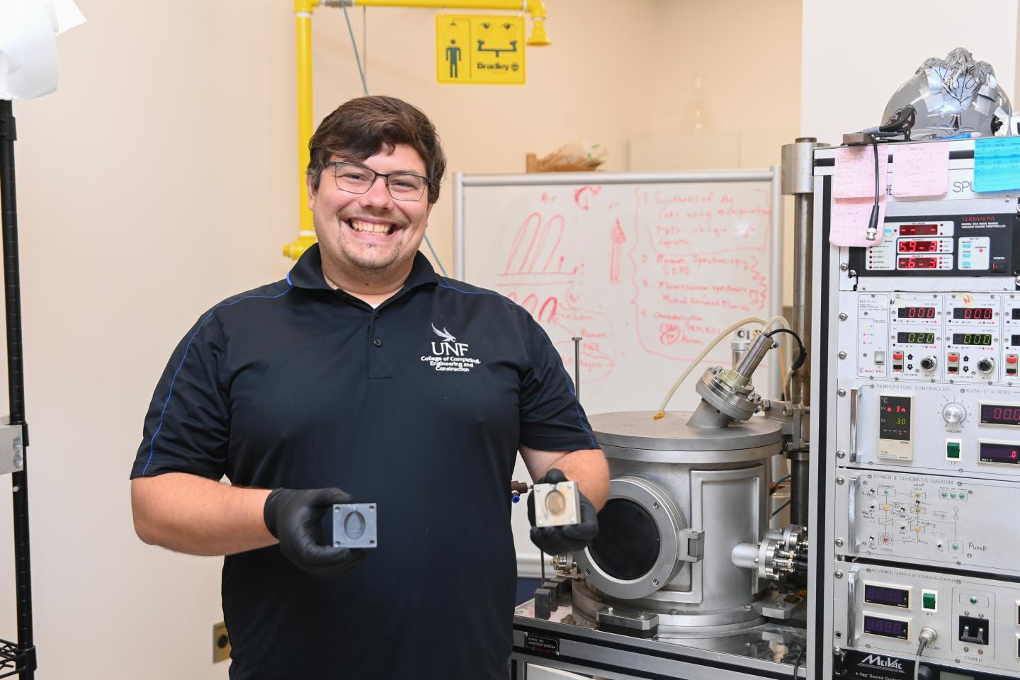 Dr. Steve Stagon in UNF 3D Printing Lab holding molds