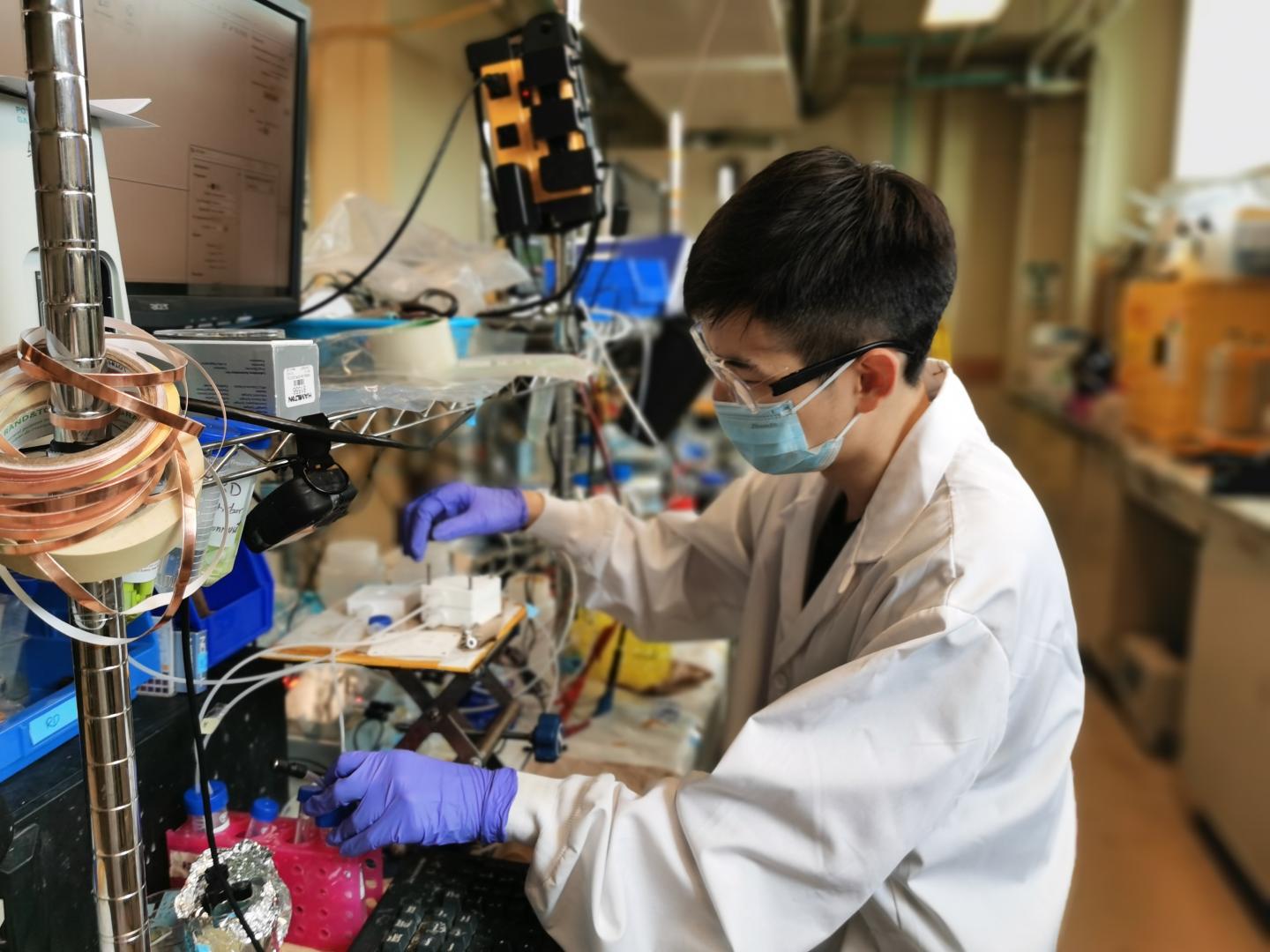 Ph.D. Candidate Jianan Erick Huang Works on an Electrolyzer