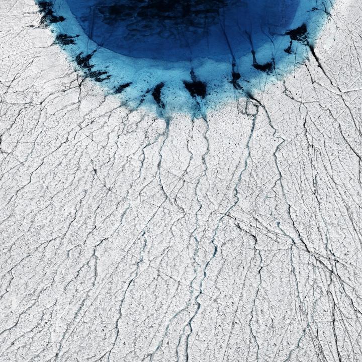 Melting of Greenland Ice Sheet Forms Lakes that Drain in Summer