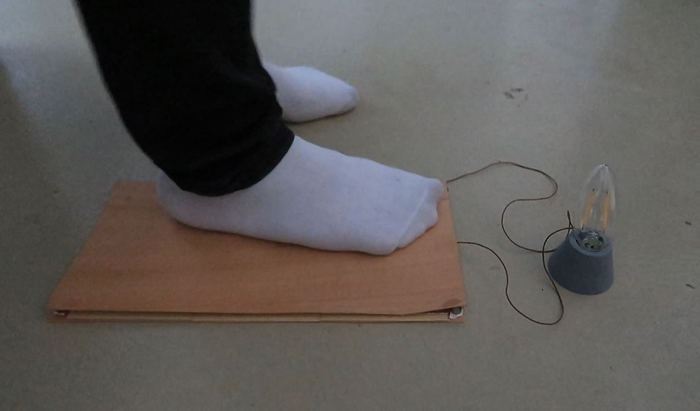 When walked on, these wooden floors harvest enough energy to turn on a lightbulb