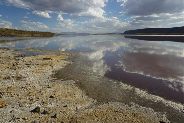 Clouds reflecting in lake Magadi, Kenya, located in the Eastern Branch of the East African Rift System