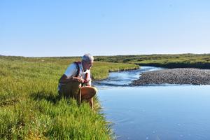 Mike Rawlins collecting data on Arctic streams.