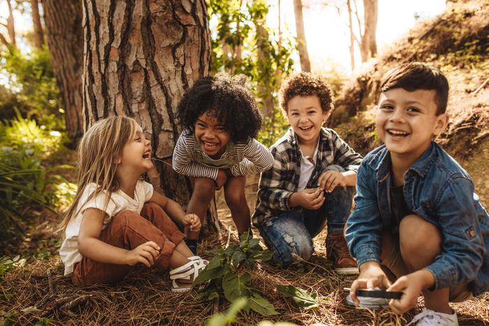 Children playing in forest