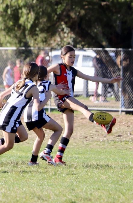 Indigenous children playing football