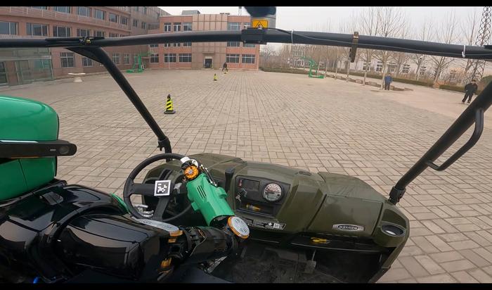 Snapshots of the humanoid robot driving at a chicane