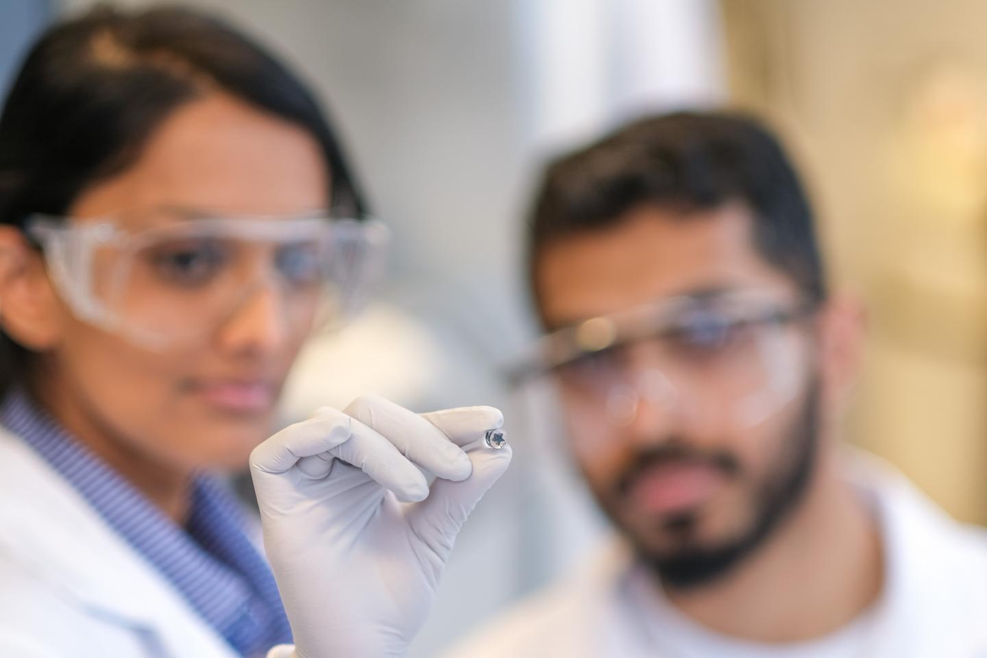 Buddhisha Udugama and Pranav Kadhiresan Holding Device