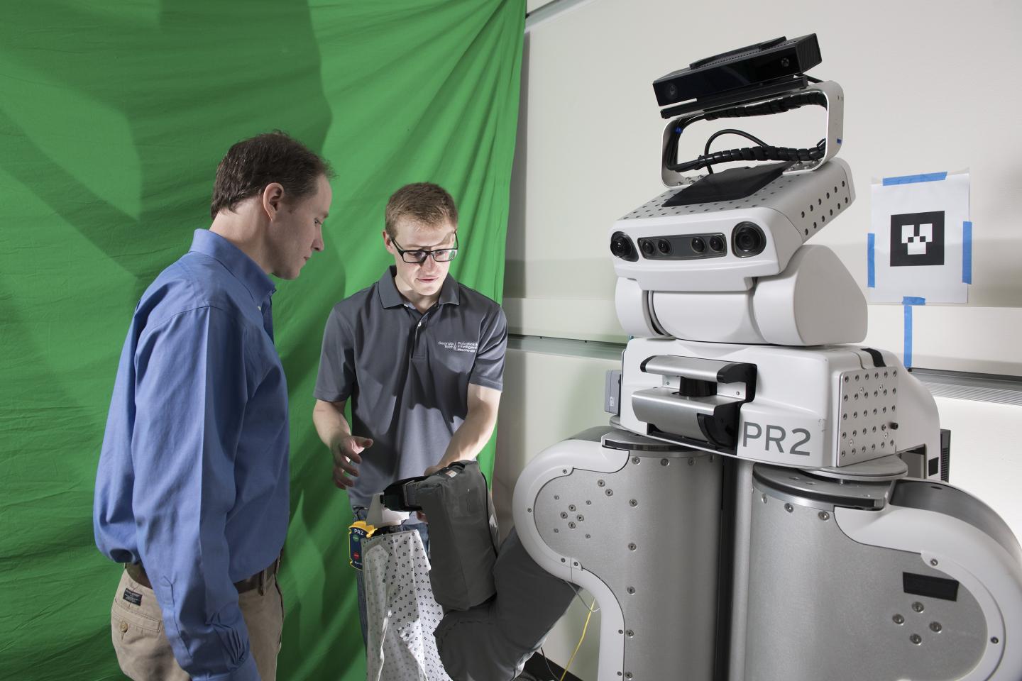 Charlie Kemp and Zackory Erickson Working with Robot