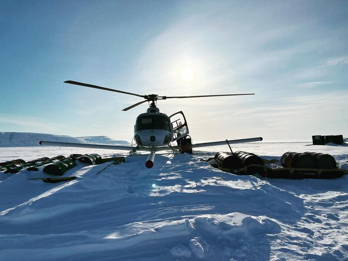 Helicopter with ice-penetrating radar on Devon Island