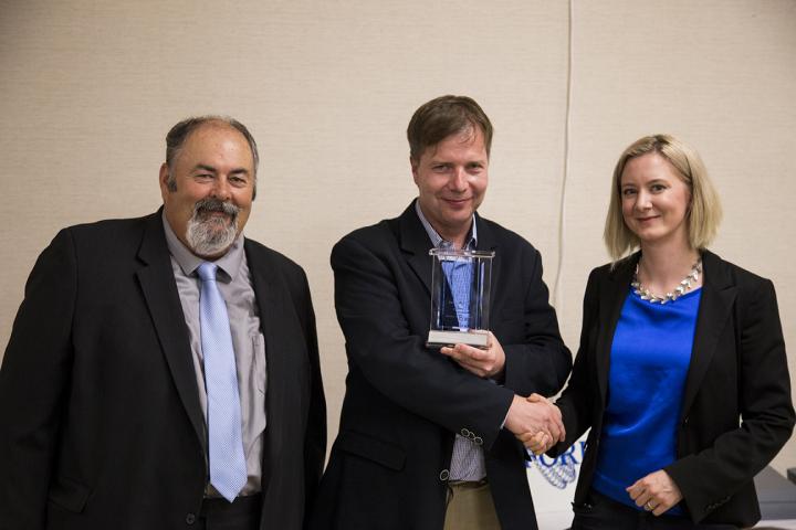 Bartosz A. Grzybowski (center) Receiving the 2016 The Foresight Institute Feynman Prize for Theory