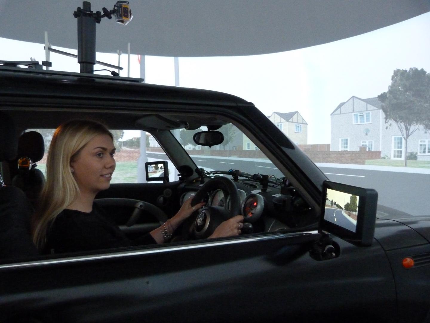 Researcher in the Driving Simulator