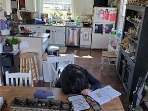 tired person with head on desk