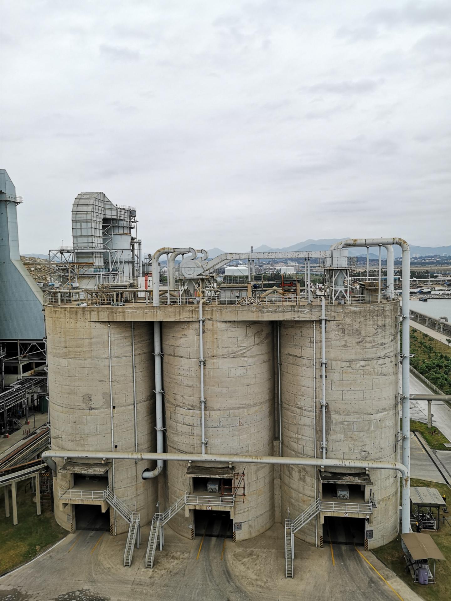 Coal ash storage warehouses of a coal-fired power plant in Nanjing City, China.