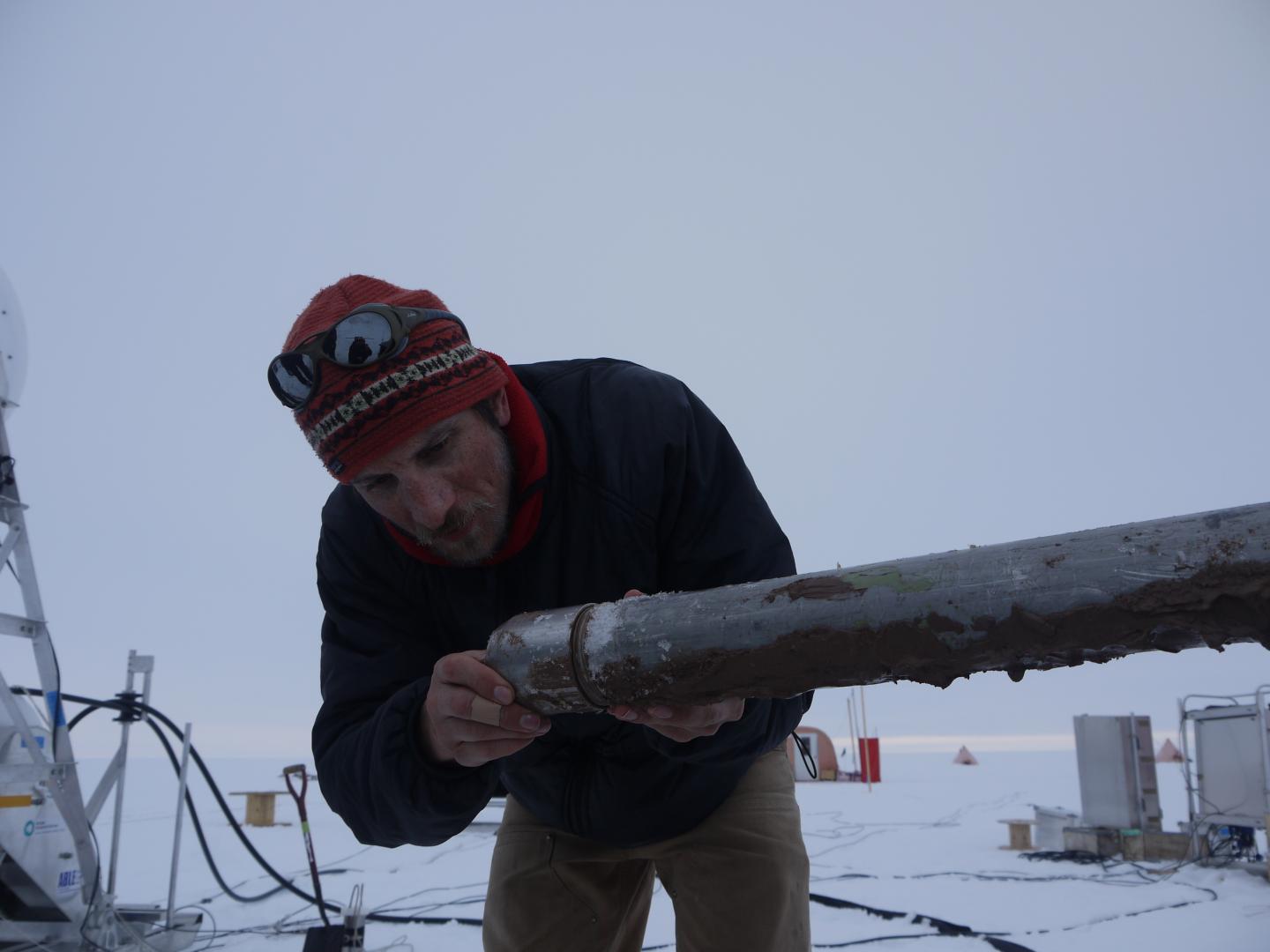 Marine Geologist Collects a Sediment Core