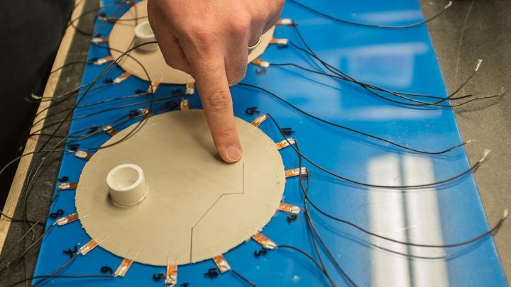 Sensing Skin Detects Invisible Cracks in Building Structures