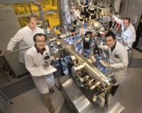 Physicist Team with Molecular Beam Epitaxy System