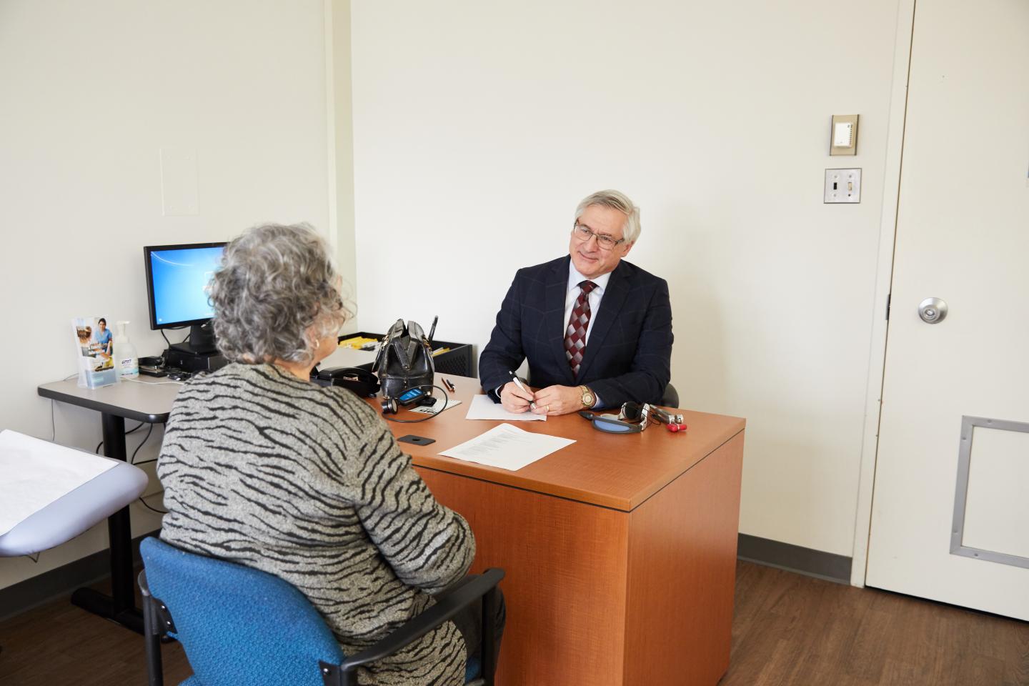 Dr. Howard Chertkow Talking with a Client
