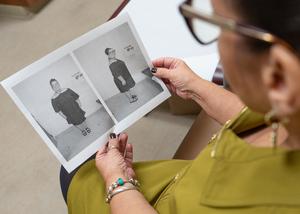 Maritza Cruz Rivera looks at photos of herself before she underwent bariatric surgery.