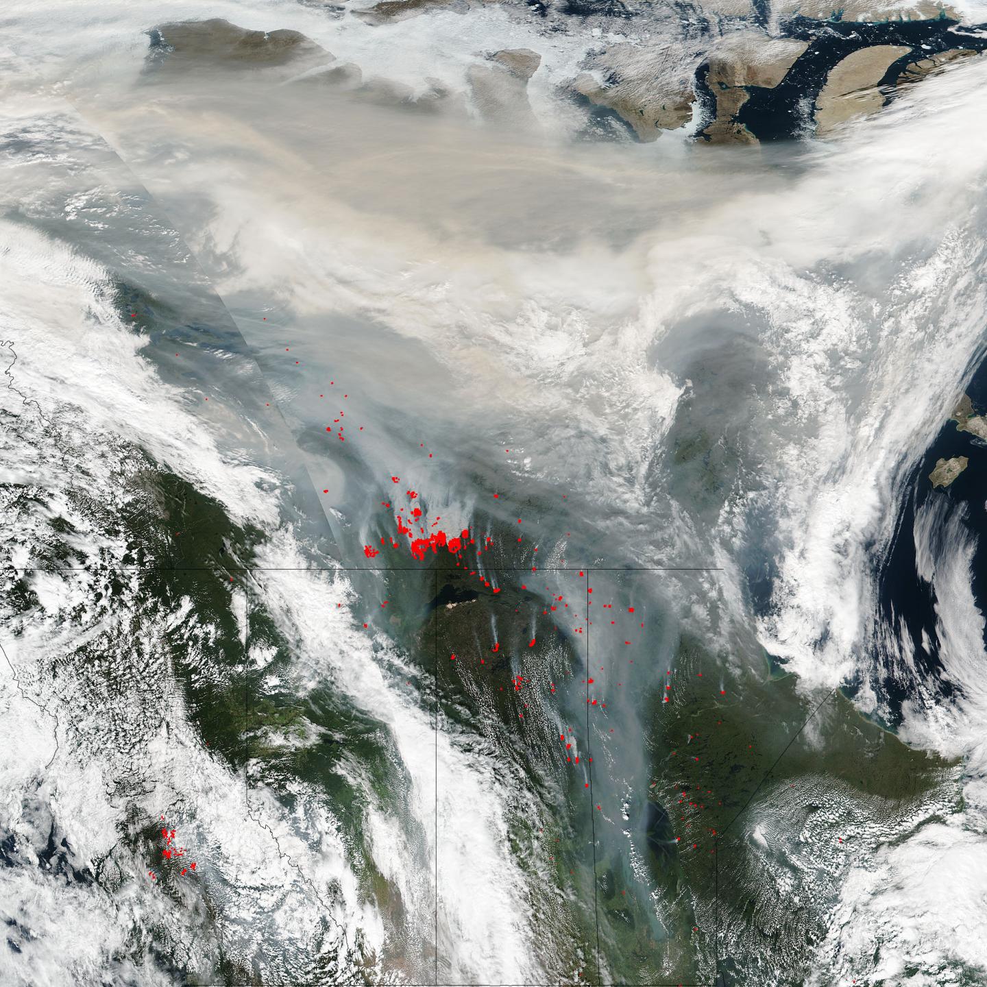 Smoke and Clouds Obscure Skies in Northern Canada