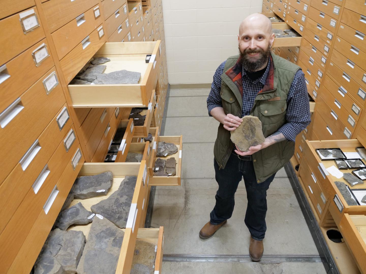 Christopher West in the USask fossil collection