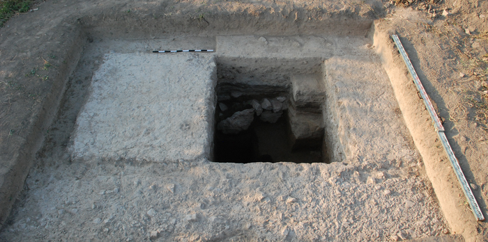 The excavation trench shows a pillar of the unfinished aqueduct.