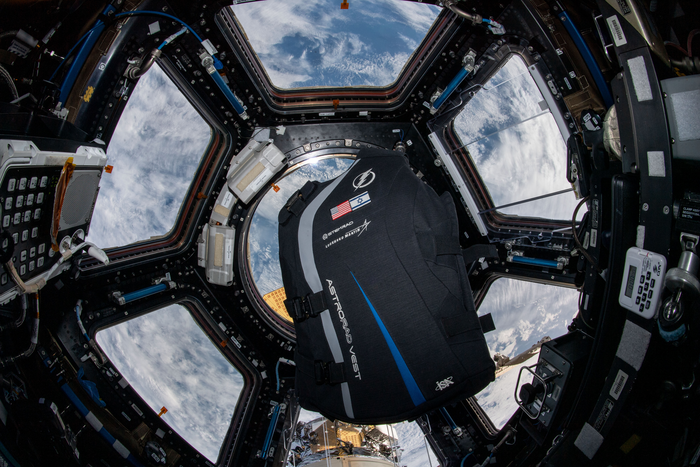 The AstroRad vest floats in the International Space Station cupola.