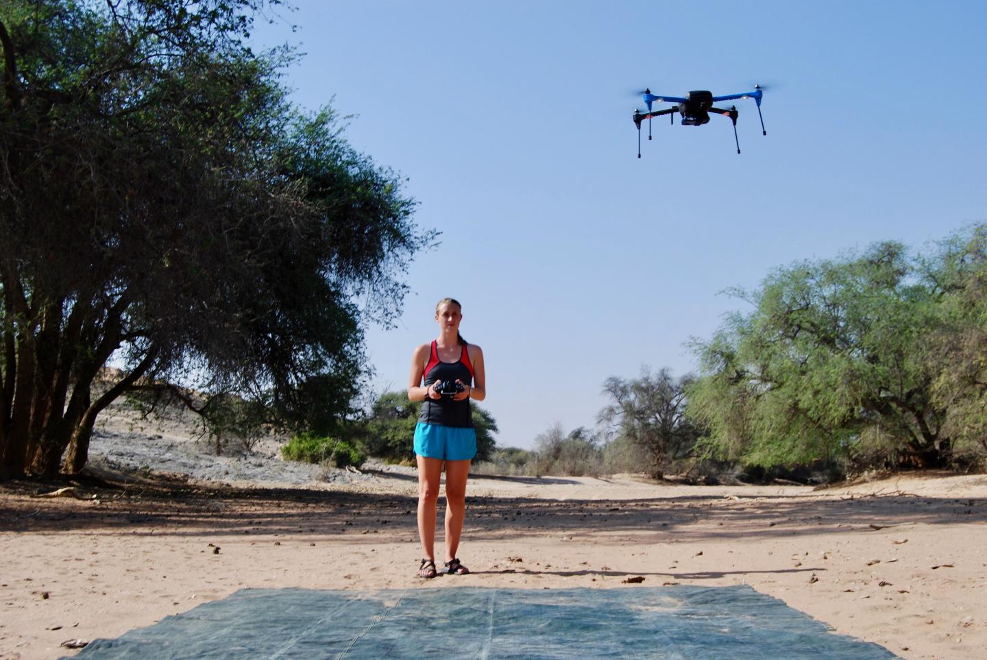 Bryn Morgan flying a drone for a research project on the Kuiseb River in the Namib Desert.