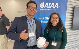 Philip Wilson and Khushi Piparava at the American Institute of Aeronautics and Astronautics conference in Stillwater, Okla.