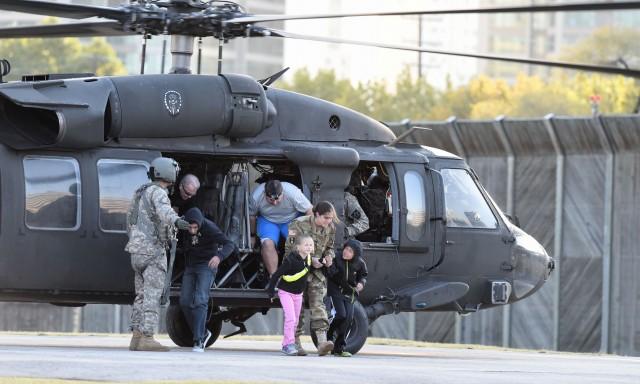 Family Members Disembark Black Hawk