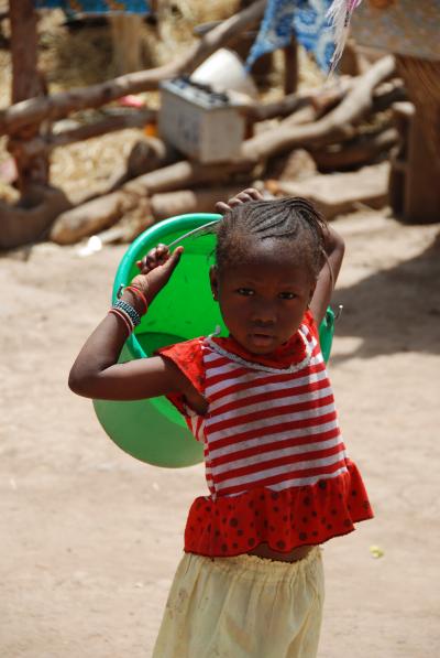 Child Fetching Water in Sub-Saharan Africa