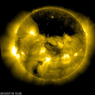 A Gigantic Coronal Hole Hovering over the Sun's North Pole