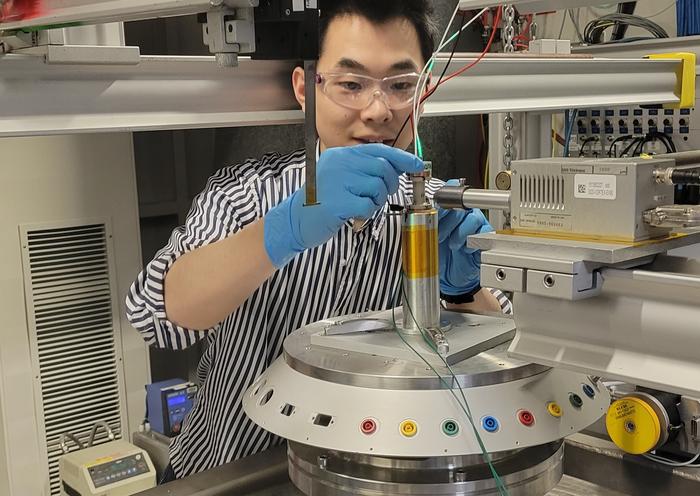 Postdoc Qiucheng Xu, preparing the reactor.