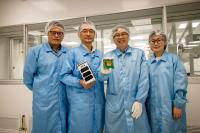 NTU Asst Prof Holden Li Holding the Miniturised Atomic Clock Tested and Proven in SPATIUM-I