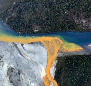 orange ribbons through Kutuk River in Alaska, aerial