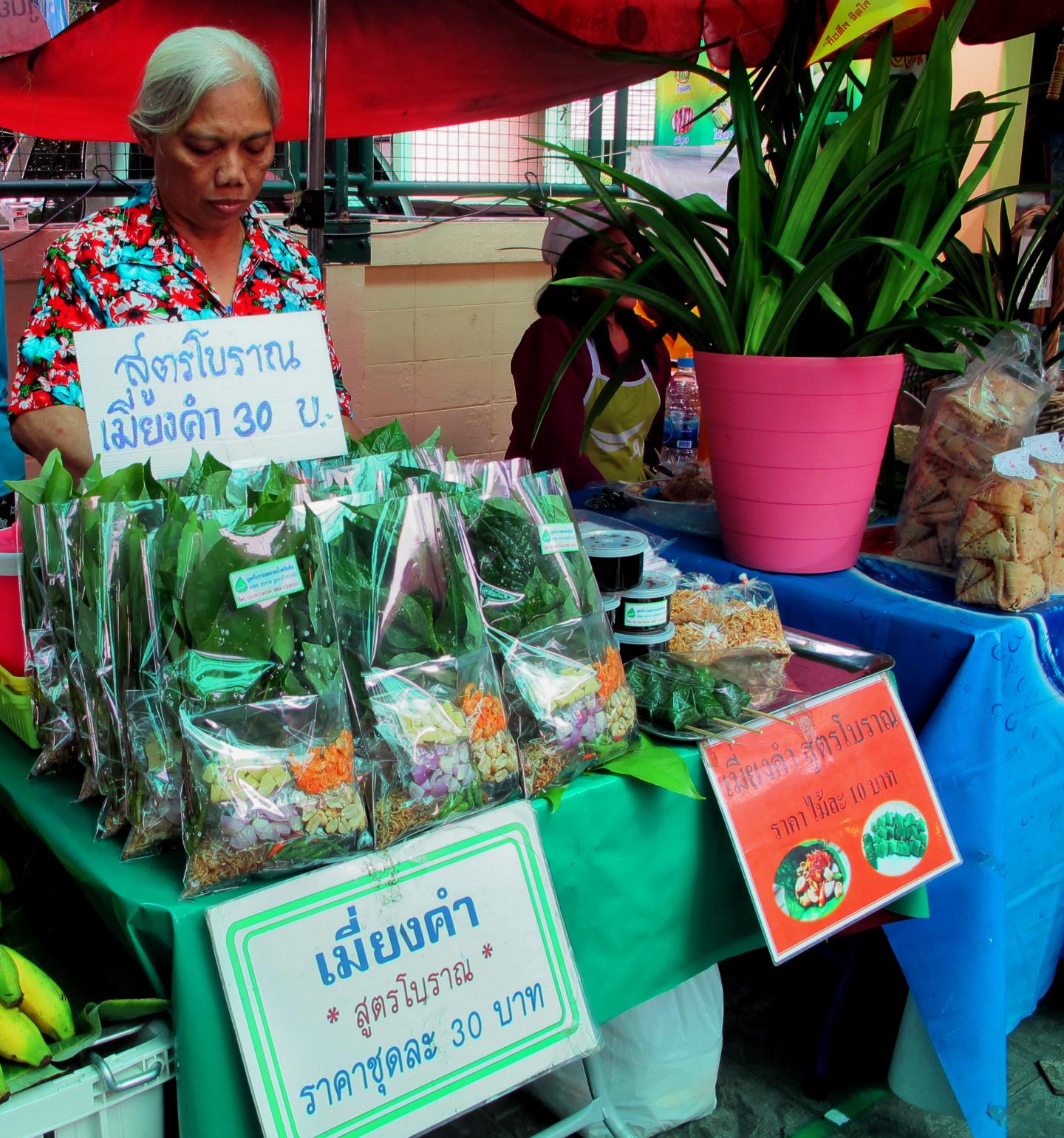 Woman Selling Vegetable Snacks in a Thai Market