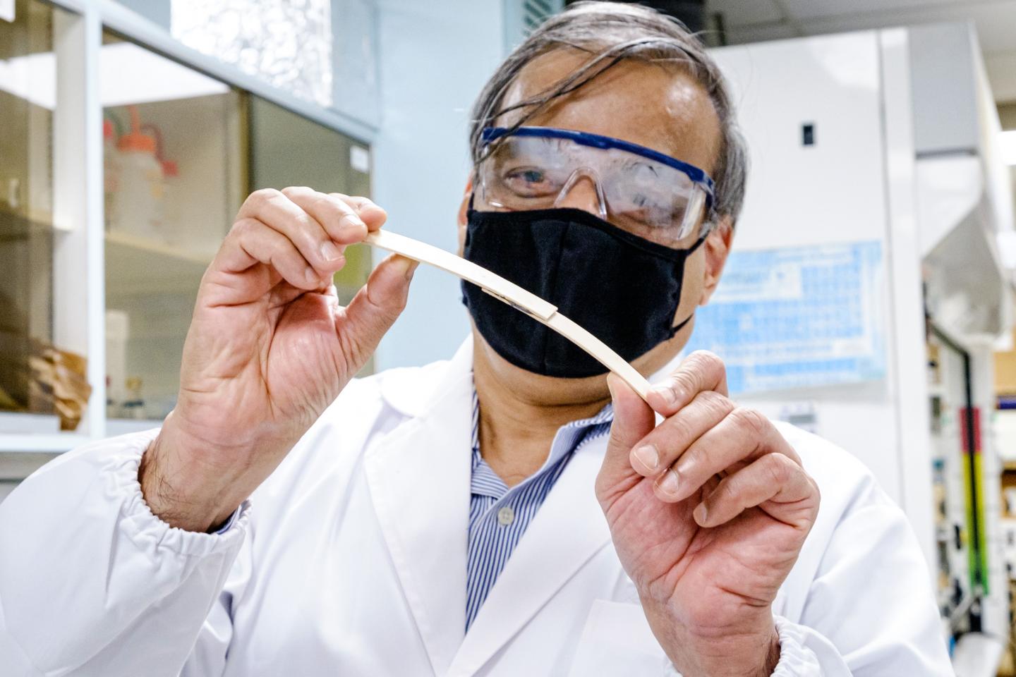 NTU Prof Raju bending two pieces of wood bonded in the middle