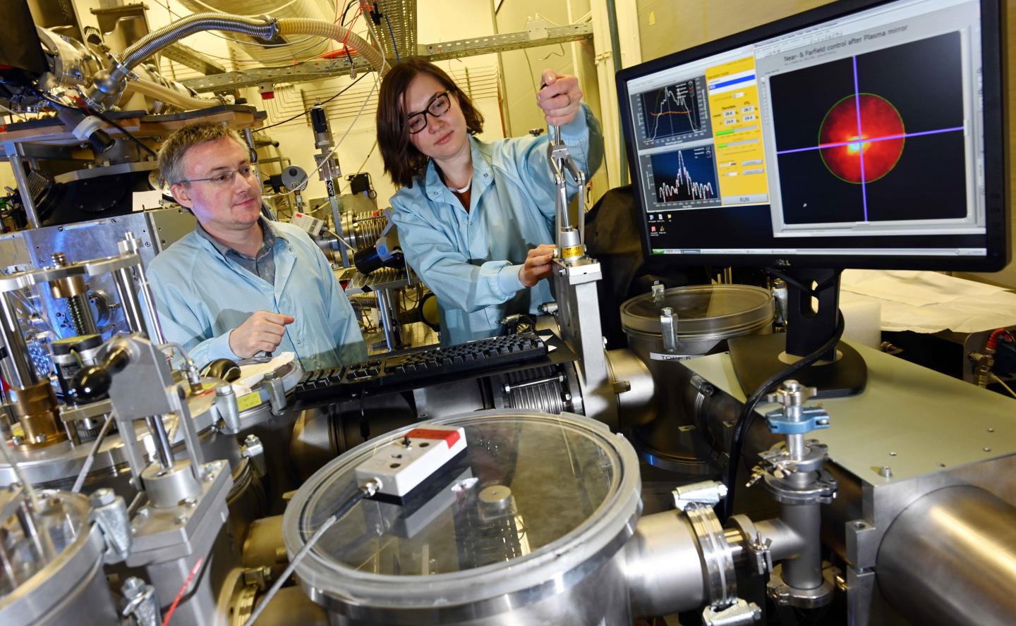 Dr. Zhanna Samsonova and Dr. Daniil Kartashov in a Laser Lab