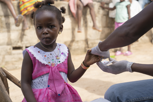 Girl getting malaria test